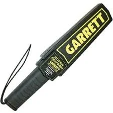 Black handheld metal detector with a wrist strap and yellow Garrett lettering on its head