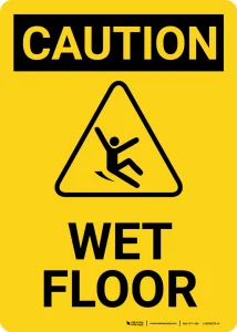 Yellow CAUTION WET FLOOR sign showing a figure slipping in a triangle, warning that the floor is slippery