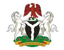 Nigerian coat of arms with a black shield, red eagle, two white horses and the motto Unity and Faith, Peace and Progress