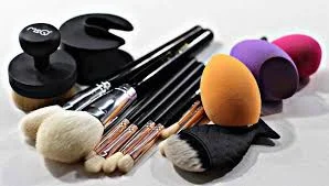 Modern makeup brushes and colourful blending sponges, shown as a contrast to local make-up materials